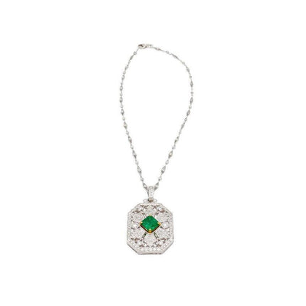 Vintage Carved Platinum 3.16 Carat Vivid Green Minor Oil Emerald Pendant with 4 CTTW in Diamonds