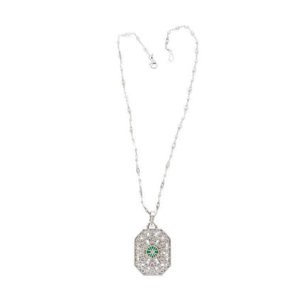 Vintage Carved Platinum 3.16 Carat Vivid Green Minor Oil Emerald Pendant with 4 CTTW in Diamonds